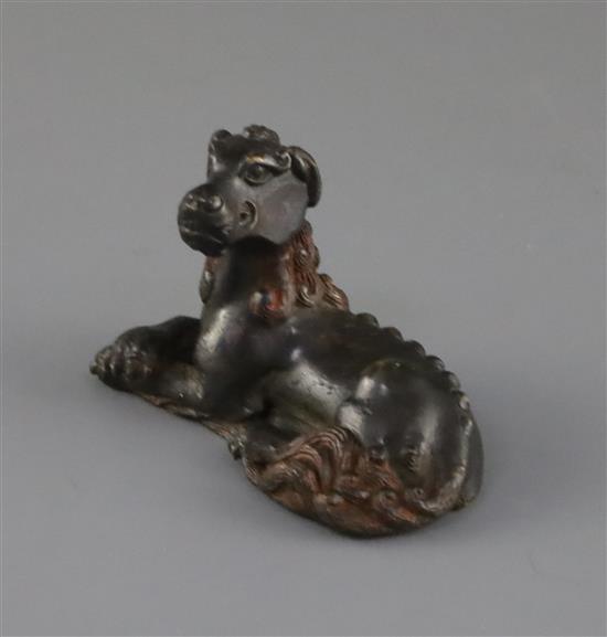 A Chinese bronze mythical beast scroll weight, 17th / 18th century, L.7.2cm